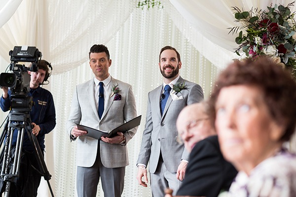 Groom waiting for bride to walk down aisle