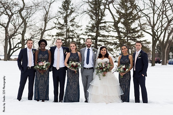 Wedding party stands in Minnesota snow