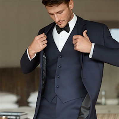 Navy three-piece suit with bowtie by Jos. A. Bank