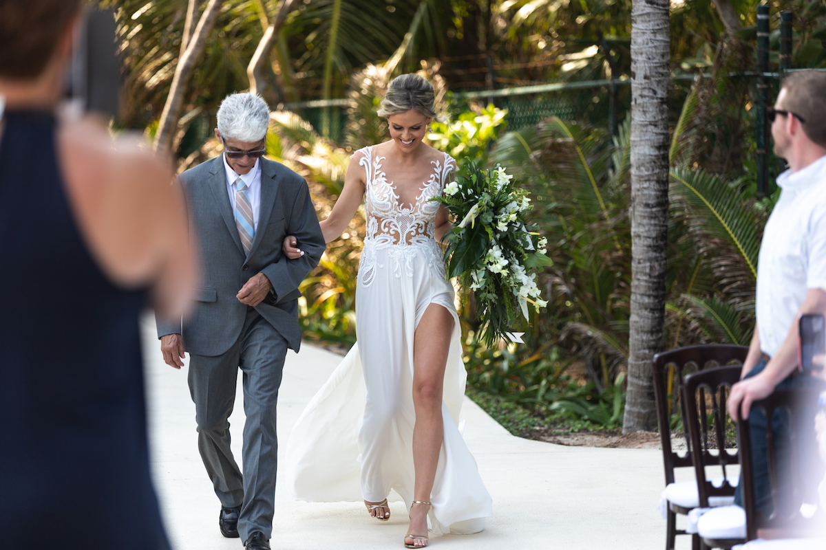 Bride walks down beachy aisle for Mexico wedding ceremony