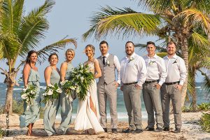 Wedding party on beach after wedding ceremony