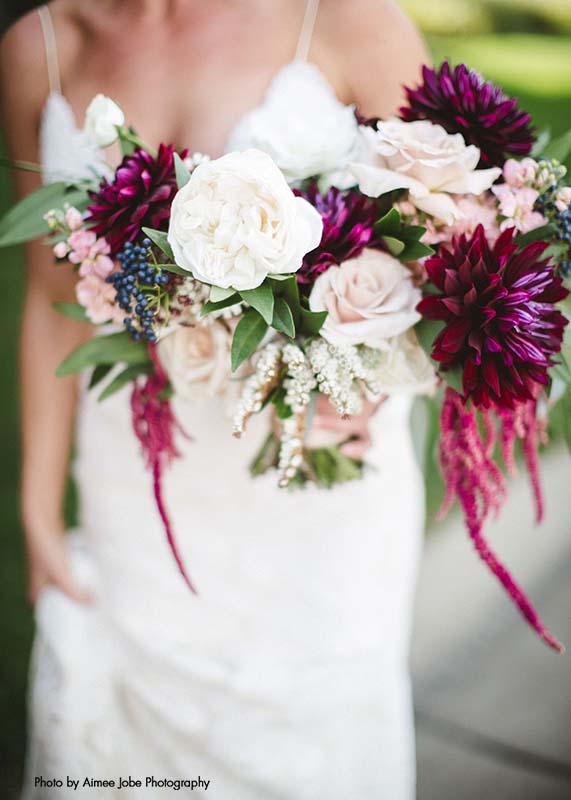 Assorted white and maroon flower bridal bouquet