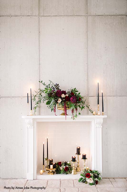 Wedding decorations with maroon, gold, white and black accents