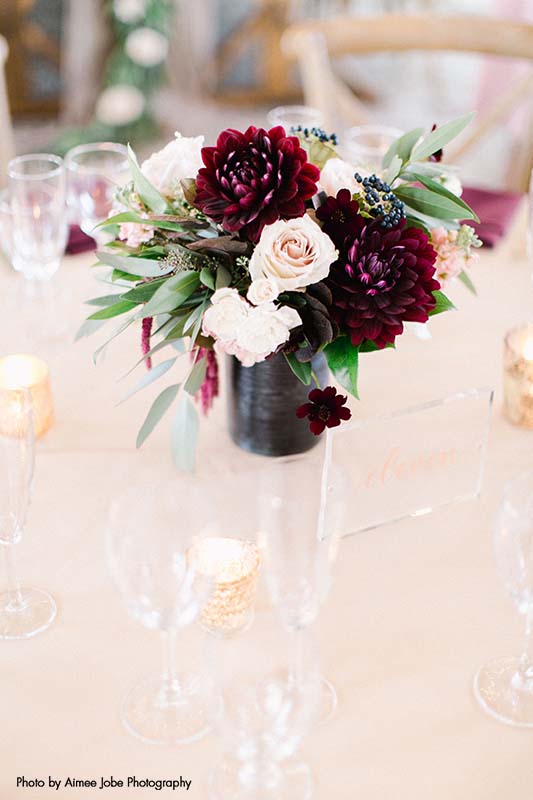 White and maroon flower bouquet wedding centerpiece