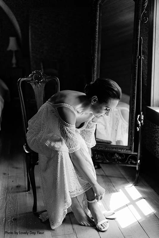 Bride putting on her heel before the ceremony