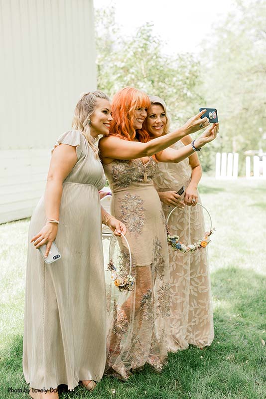 Bridesmaids in neutral colored dresses