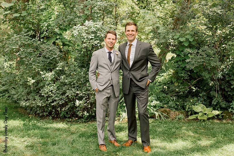 Groom and groomsman before the ceremony in gray suits