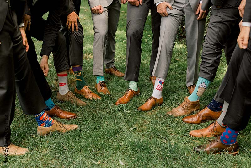 Groomsmen wearing fun socks