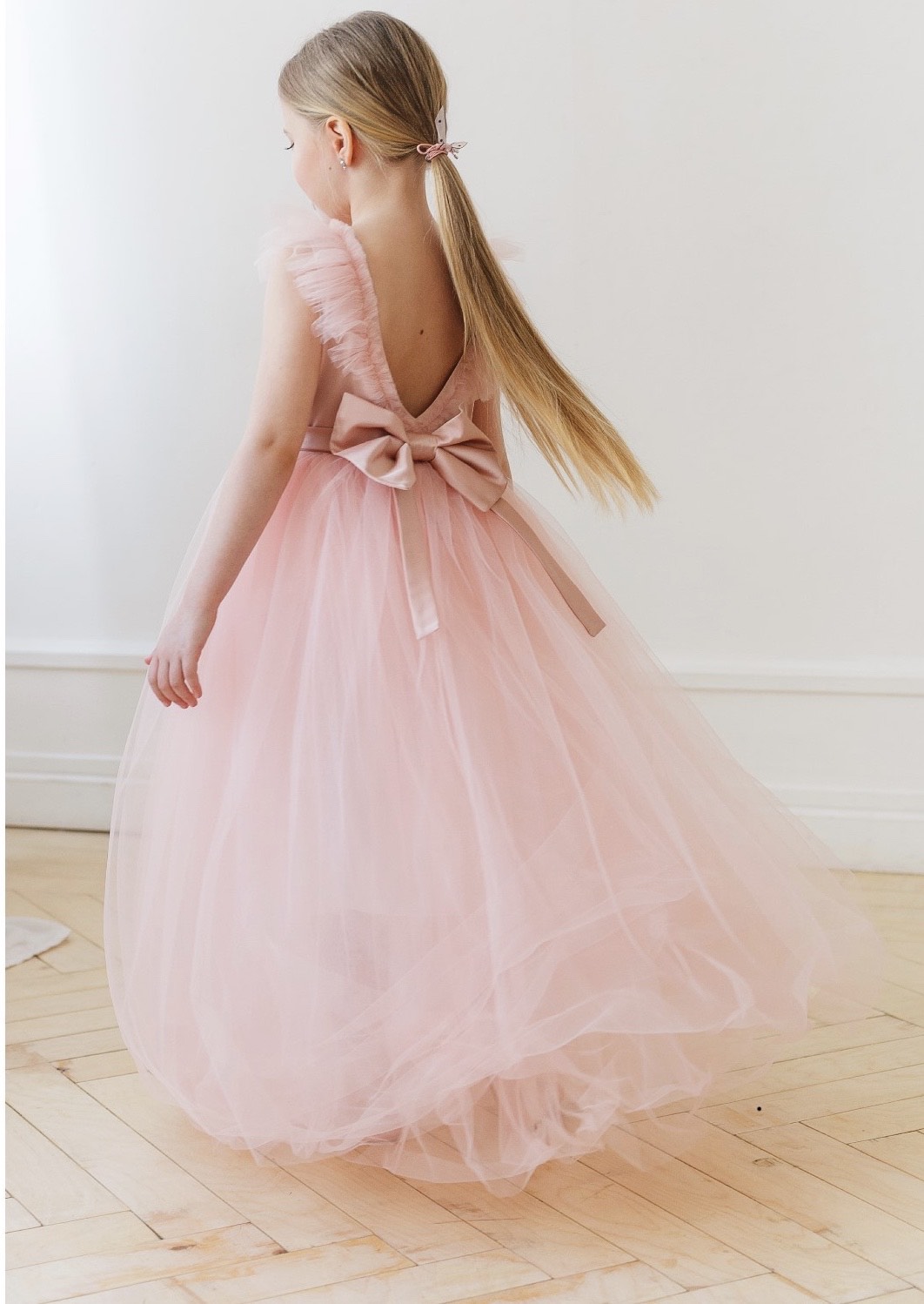 Girl in pink dress with bow