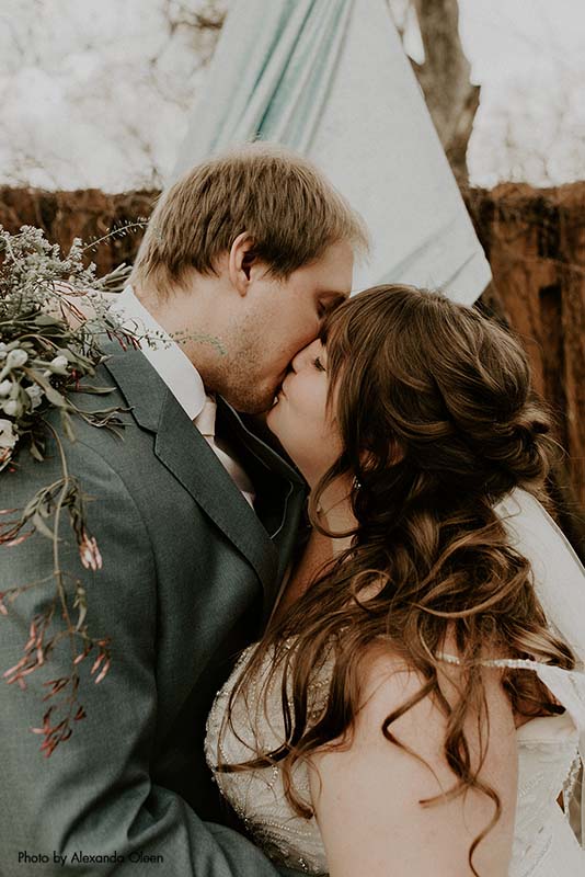 Bride and groom celebrate first kiss