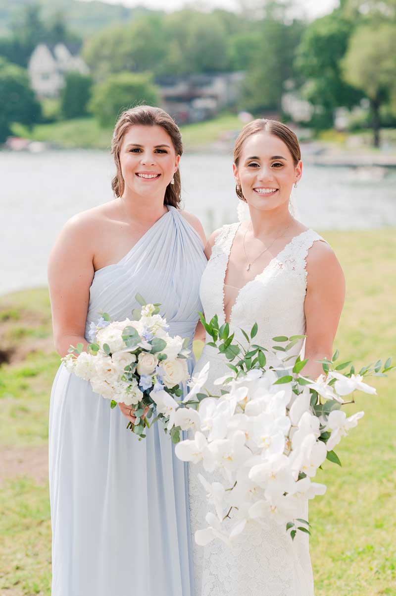 Bridesmaid wearing light blue one shoulder dress