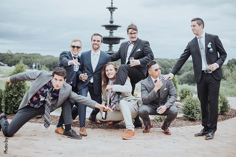 Groomsmen pose for funny picture at wedding