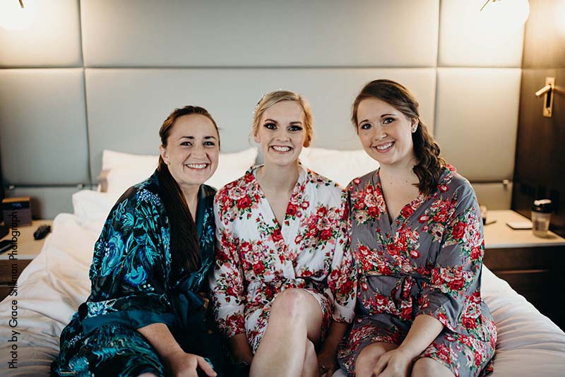 Bridal party in floral robes get ready for hotel wedding at MSP Airport