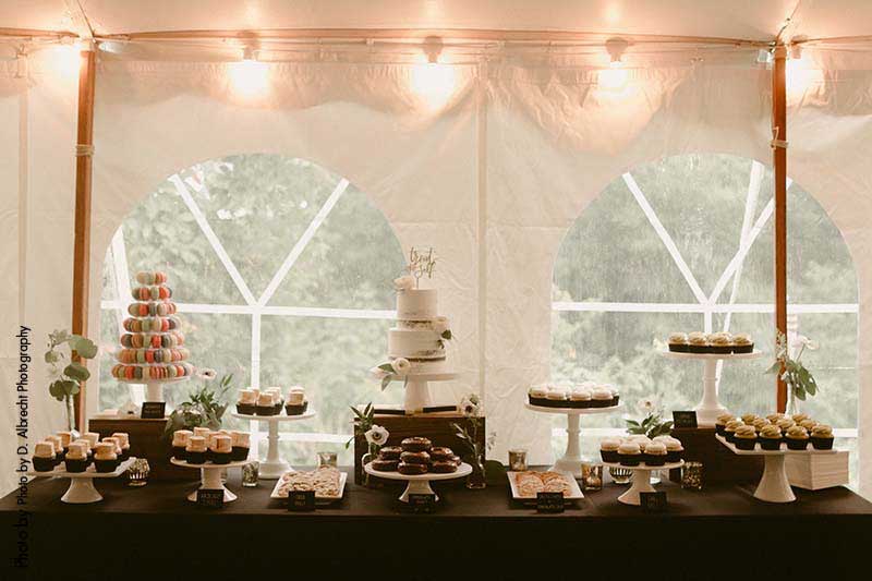 Dessert display with cakes, cupcakes, and macarons