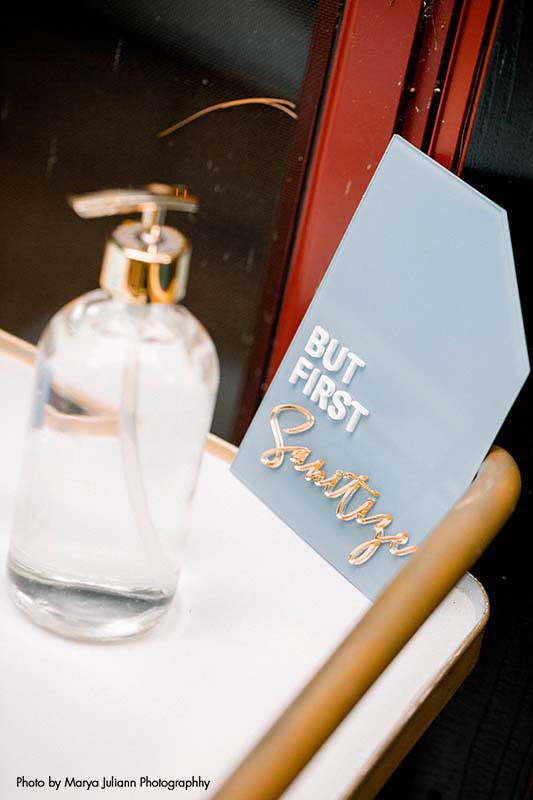 Wedding signage for intimate wedding that says "But first, sanitize"
