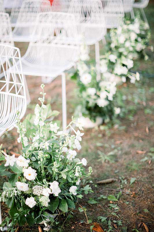 White flower and greenery aisle decor