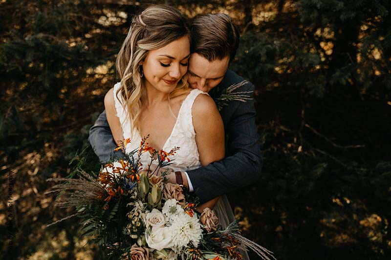 Bride and groom at their fall outdoor wedding