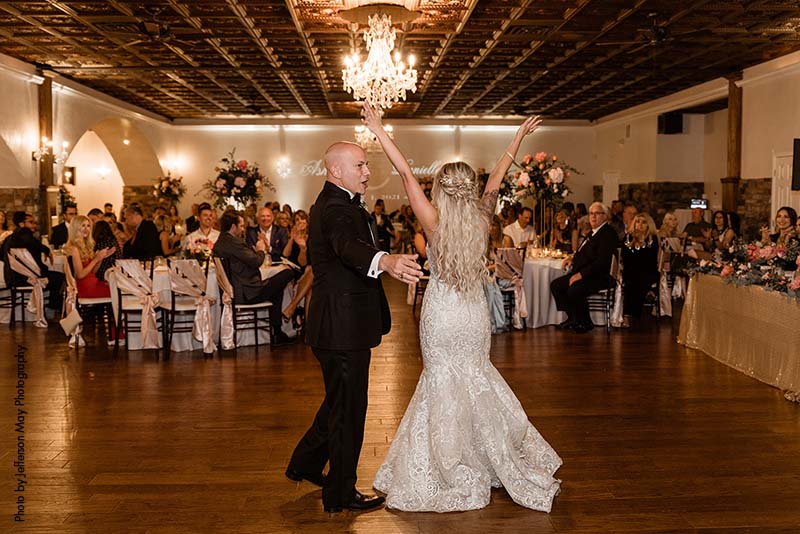Bride dances with father at wedding reception
