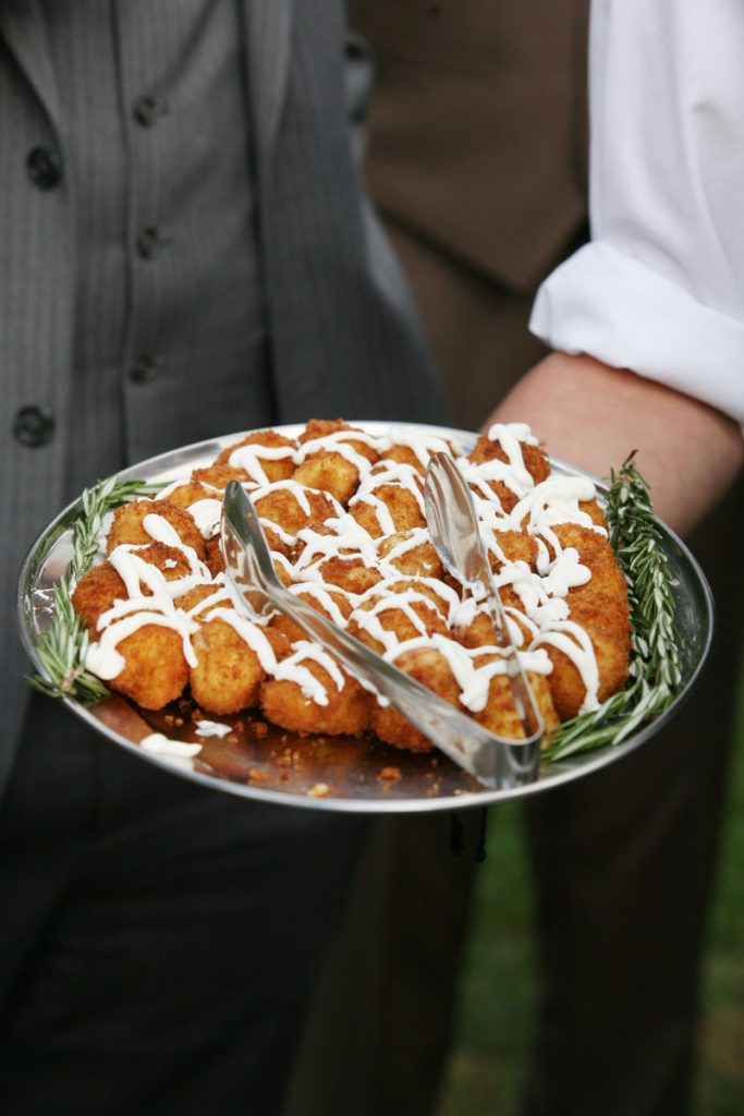 Deep-fried wedding appetizer served on silver platter