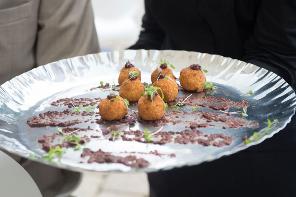 Arancini wedding appetizer served on silver platter