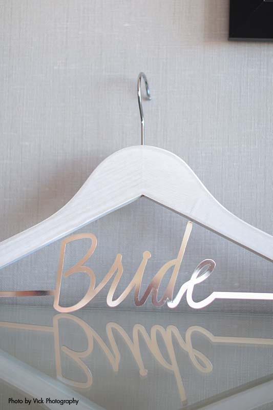 Custom wedding dress hanger that says bride in gold wire