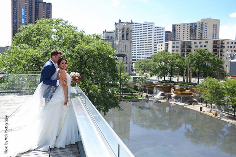 Bride and groom on top of orchestra hall