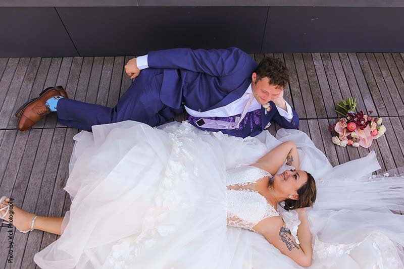Bride in white dress and groom in blue suit