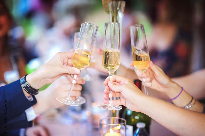 Champagne toast at summer backyard wedding reception