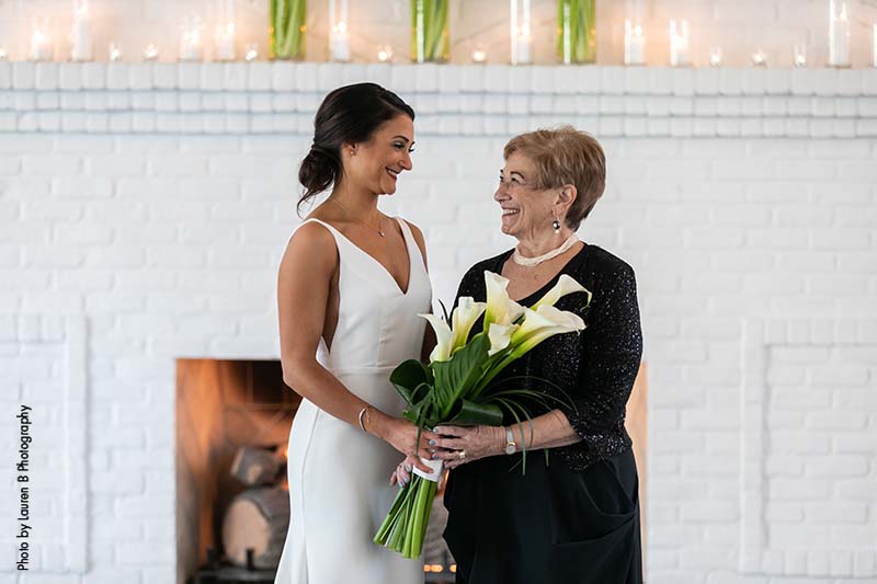 Mother of the bride in simple black sparkly dress