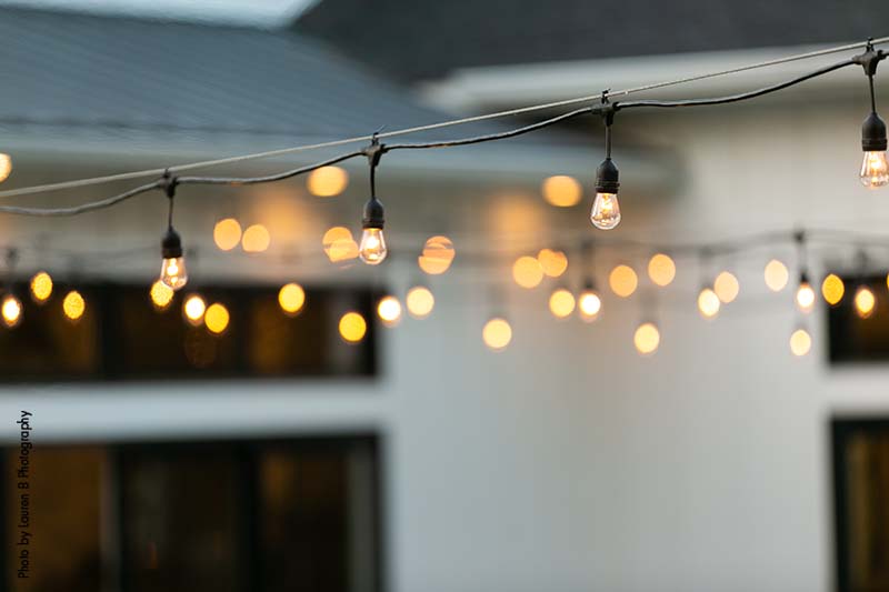 String lights at modern wedding reception