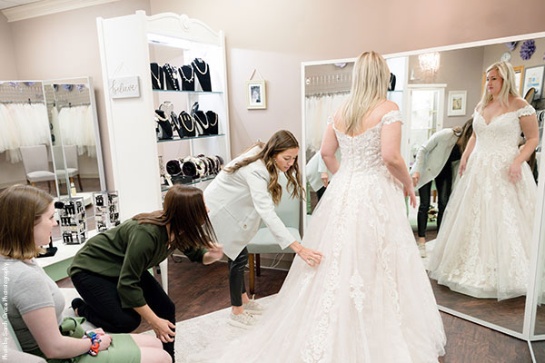 Bridal Consultant helps bride find off-the-rack gown