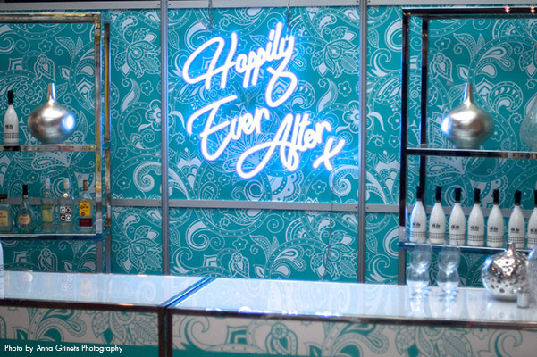 Blue neon sign that says "Happily Ever After"