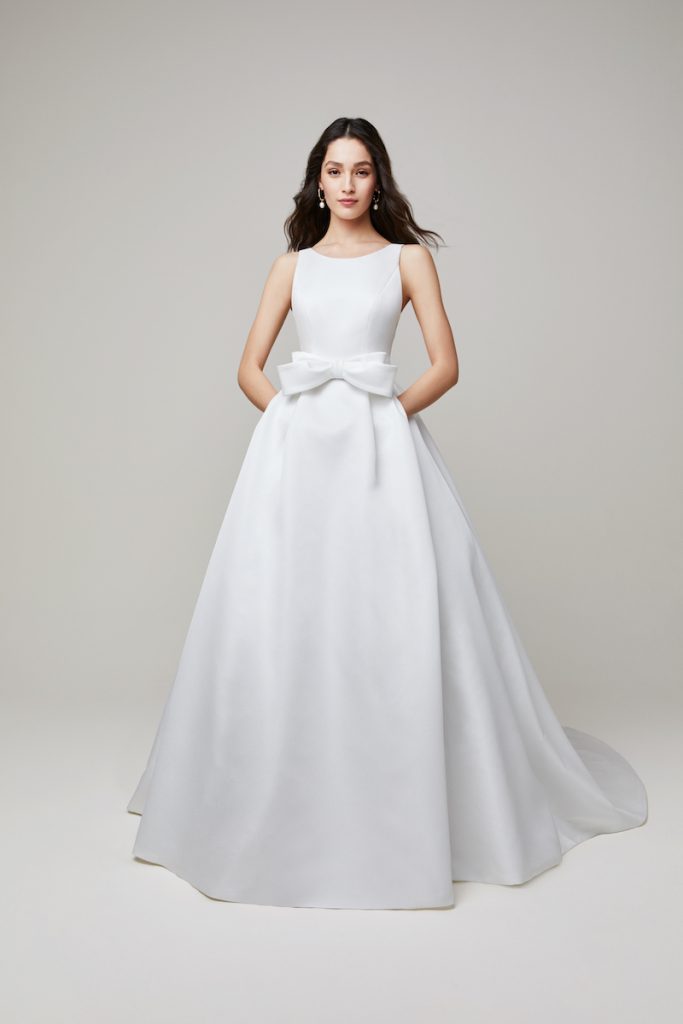2022 bridal fashion trends bow on front of dress by Jesus Peiro
