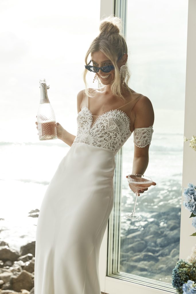 Wedding gown with textured lace and detachable sleeves