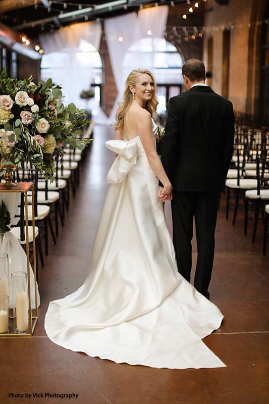 Bridal gown with long bow on the back