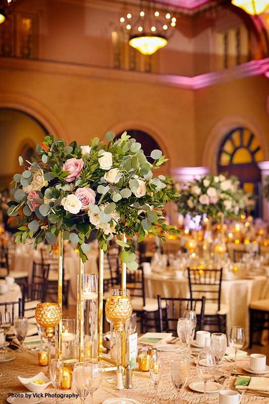 Tall assorted rose and greenery wedding centerpieces