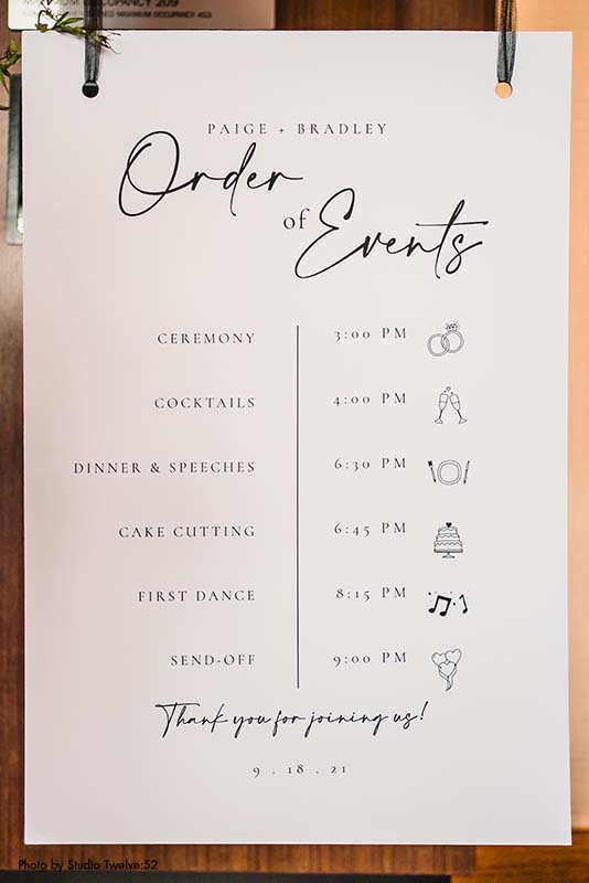 Modern black and white wedding order of events sign
