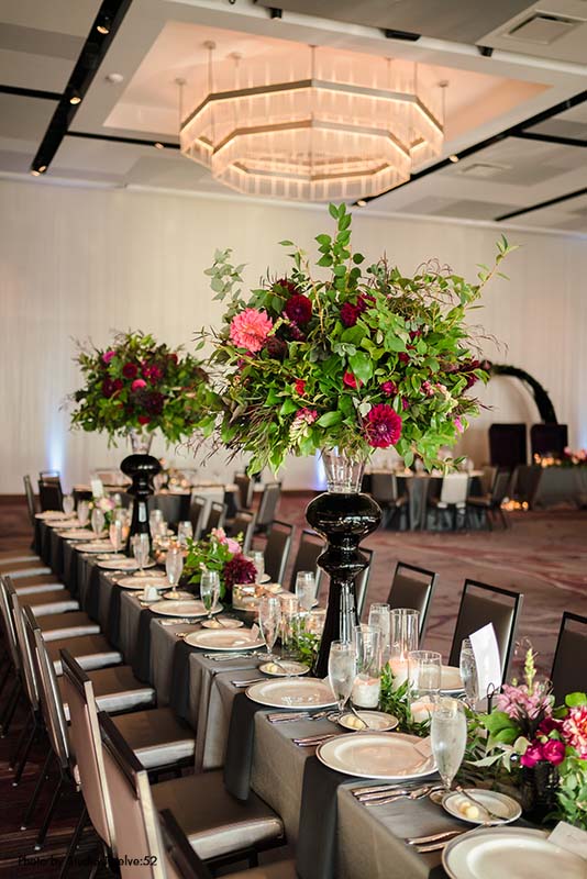 Tall flower and greenery wedding centerpieces