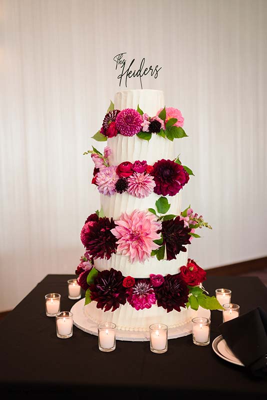 Pink and purple floral wedding cake