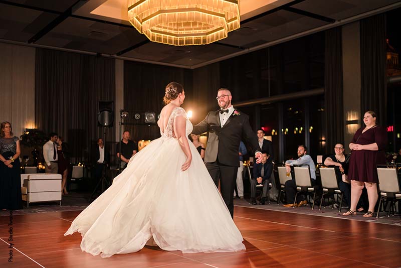 Bride and groom first dance at modern fall wedding