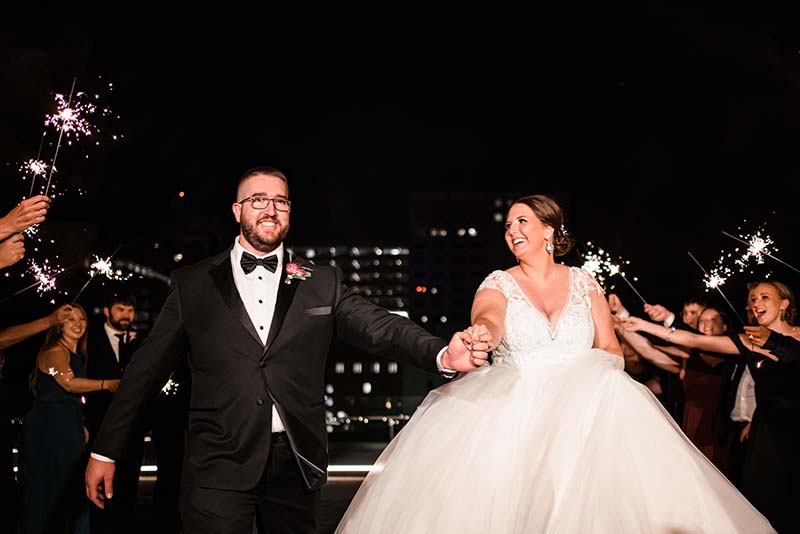 Bride and groom leave ceremony with sparkler send off