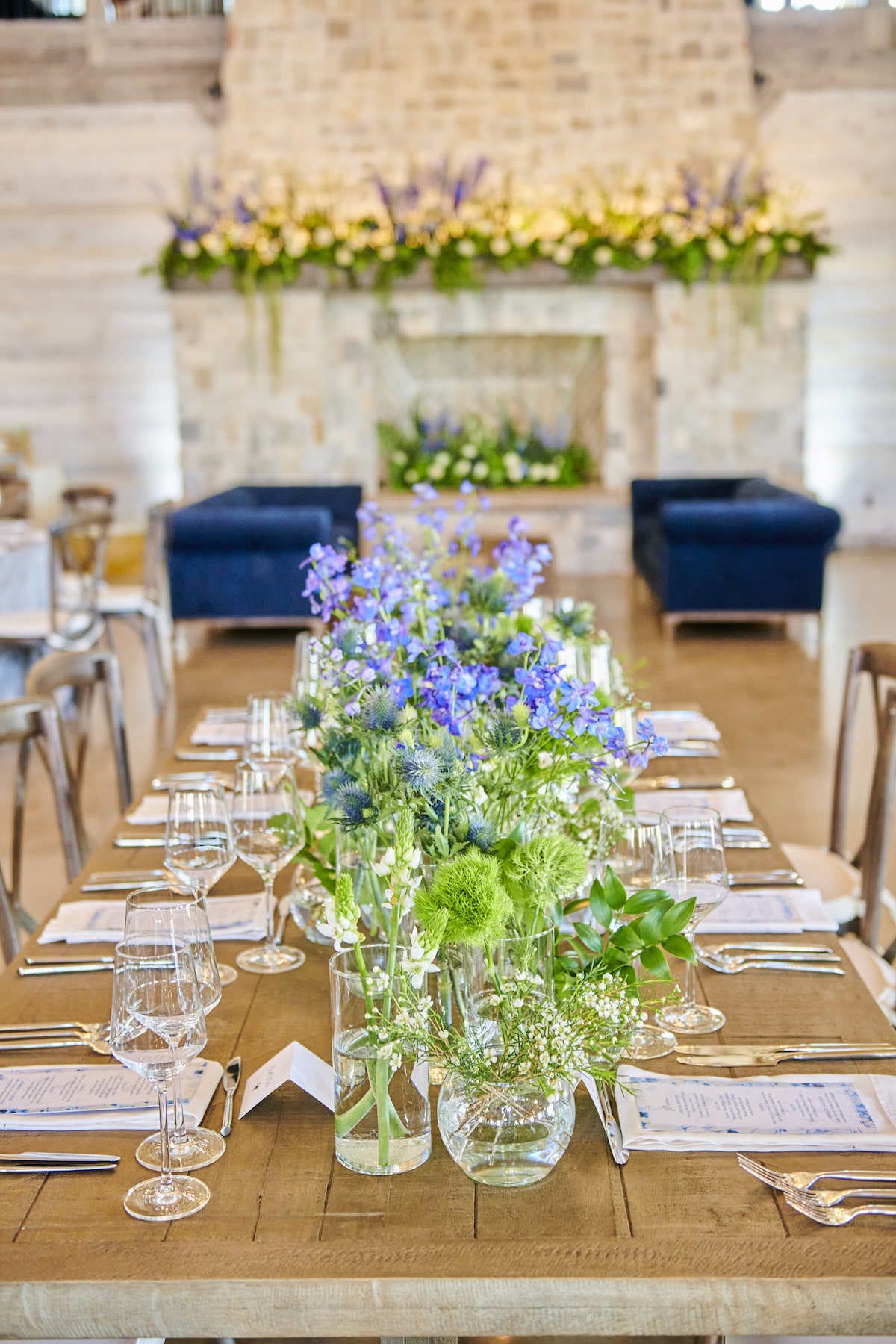 Bright wildflower centerpieces on wedding table