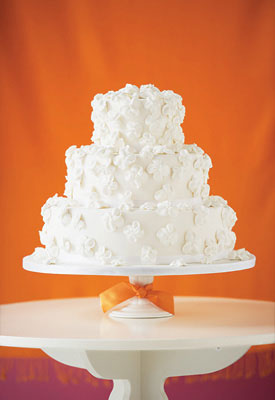 White wedding cake with piped flowers by Hy-Vee Bakery