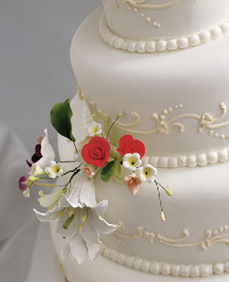 Intricate sugar flowers on a wedding cake