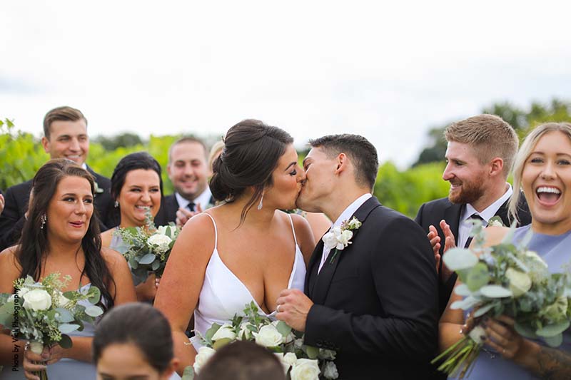 Bride and groom share kiss at Minnesota fall wedding
