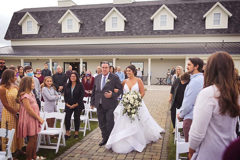 Father walks bride down the aisle at Minnesota outdoor wedding ceremony