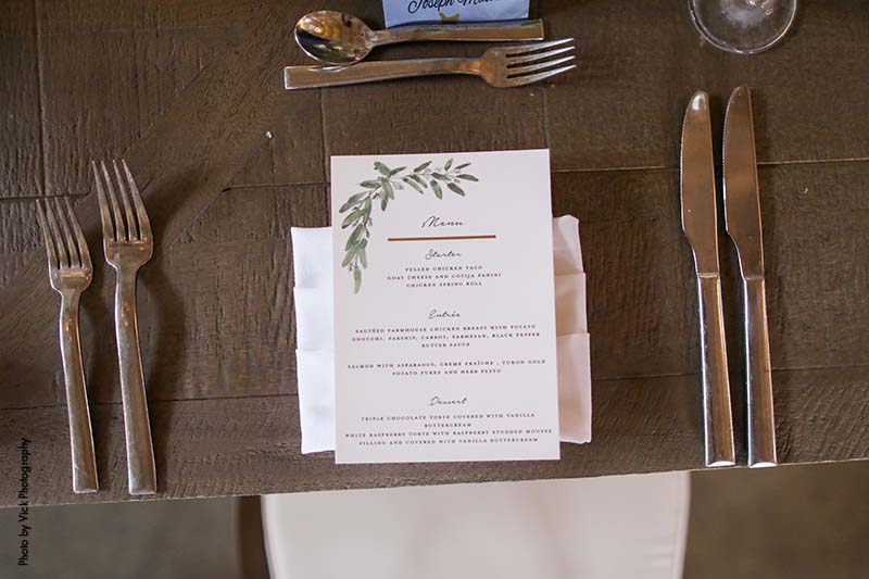 Wedding menu on white stationary with green detail