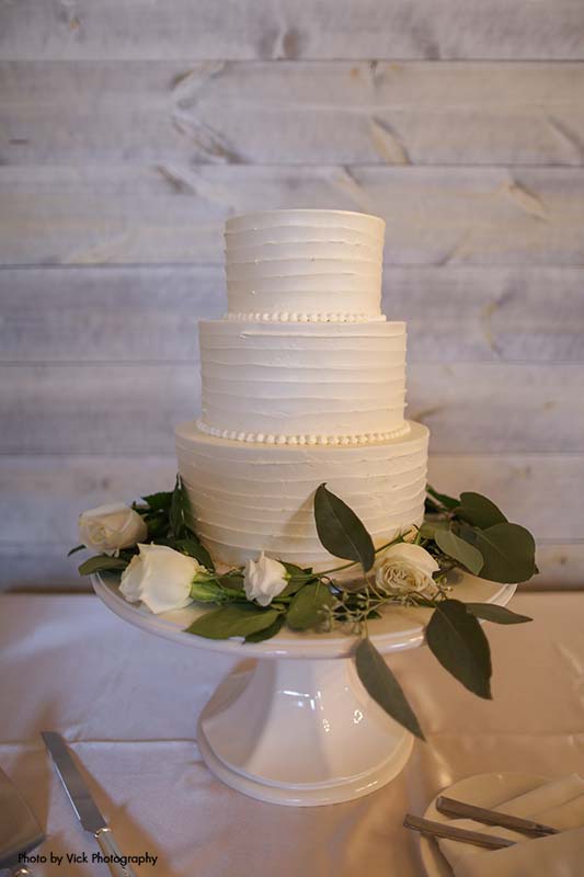 Classic white three tiered wedding cake