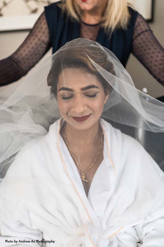 Bride is draped with veil