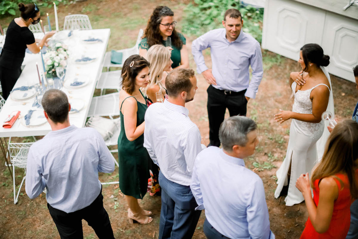 Guests gather at wedding cocktail hour